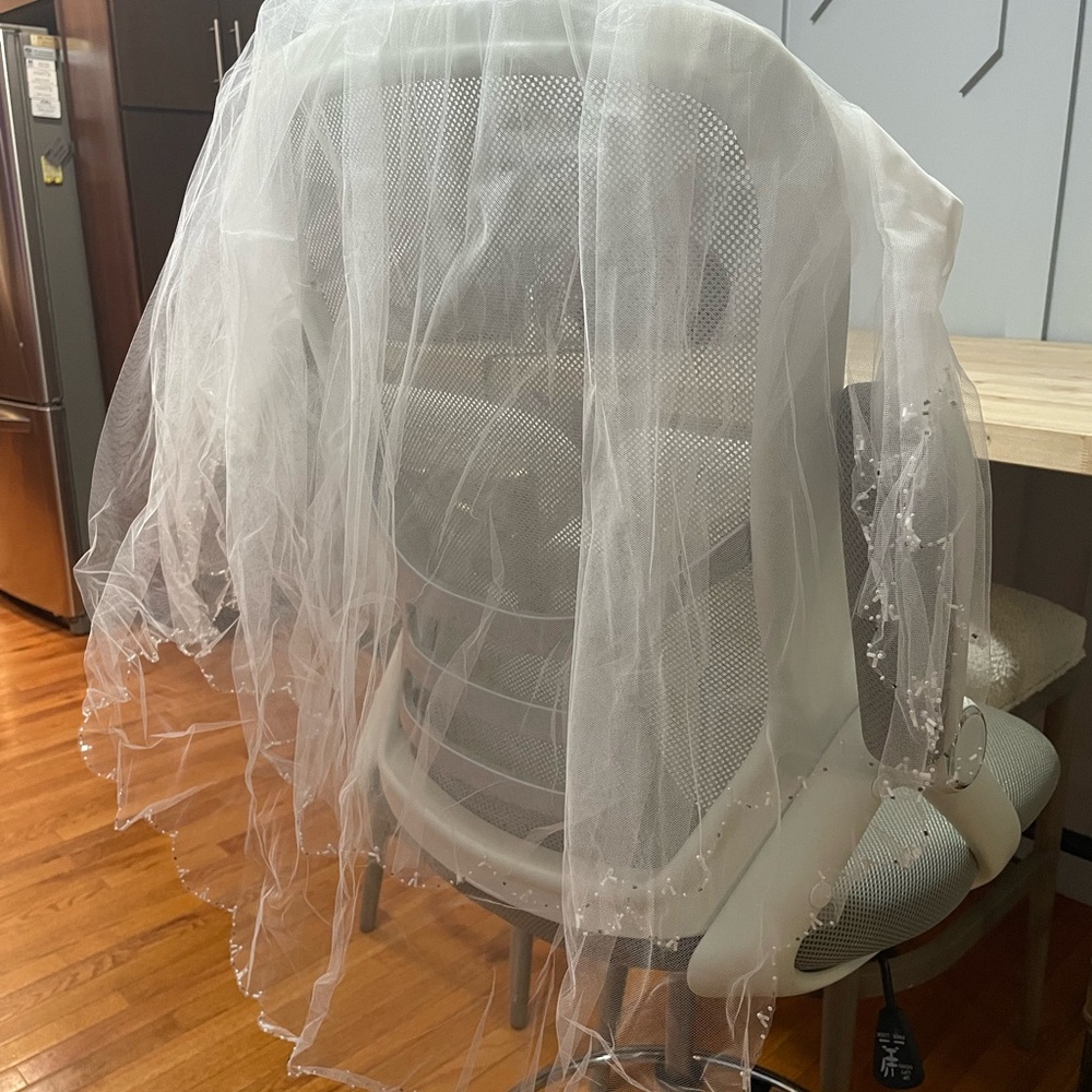 Mid length white wedding vail
